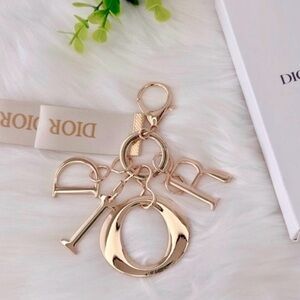 NIB Dior Gold Letter Bag Charm with Cream Ribbon 🤩